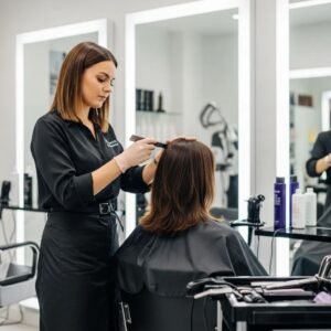 Luxurious hair salon scene with a stylist applying multi-dimensional brunette hair color to a client