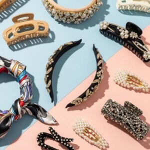 Trendy hair accessories for 2025 including claw clips, headbands, and scarves arranged in a stylish flat lay